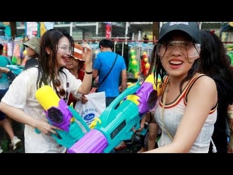 Water splash Songkran festival at Pattaya Walking Street, Foreigners enjoying Holi of Thailand